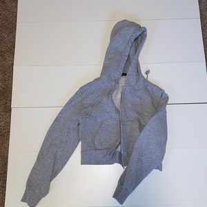 Soft fleece zip up hoodie. One size. I’m a small for reference.